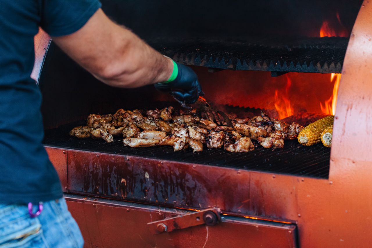 Flames and smoke rising off a barbecue
